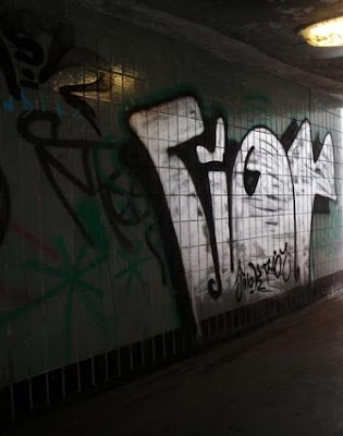 Shadowed Tribal Graffiti Alphabet Under the Bridge