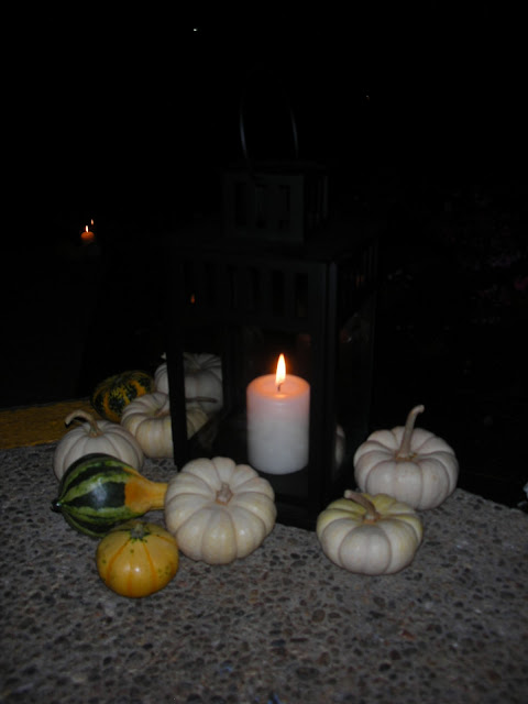 Black lanterns and surrounding pumpkins were set on the stairway leading up