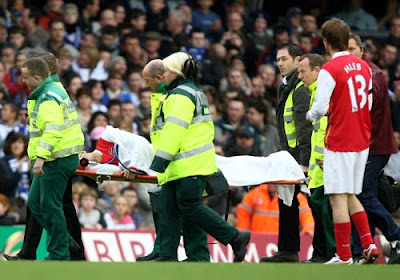 Eduardo da Silva of Arsenal is stretchered off after breaking his leg