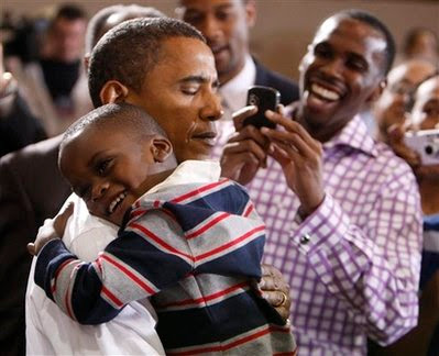 Obama holding little boy