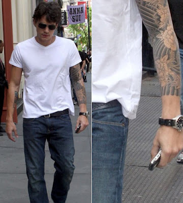 Picture of John Mayer wearing white t-shirt showing off his sleeve tattoo.