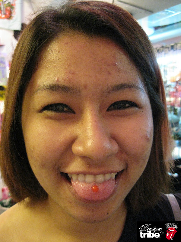 Tongue piercing title=