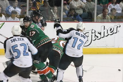 Credit:Jane Rickard, most face offs look like tangos, this looks like a mosh pit. still Stevie martins and jordan Lavallee seem to cope well.Kelson Wilson for Milwaukee, Alexander Sulzer would be helped off of the ice moments later with a possible upper body injury.