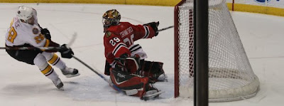 Credit:Jane Rickard, I have better photos of Corey Crawford, but this one is a favorite. It looks like he is about to take flight, it was taken during game 3 of the 2008 Wolves/Rockford Series of the playoffs. Now that was a series that was...