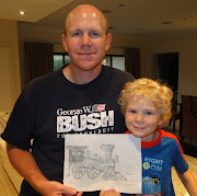 Sage and Rhett with the train drawing the two worked on. (dsc )
