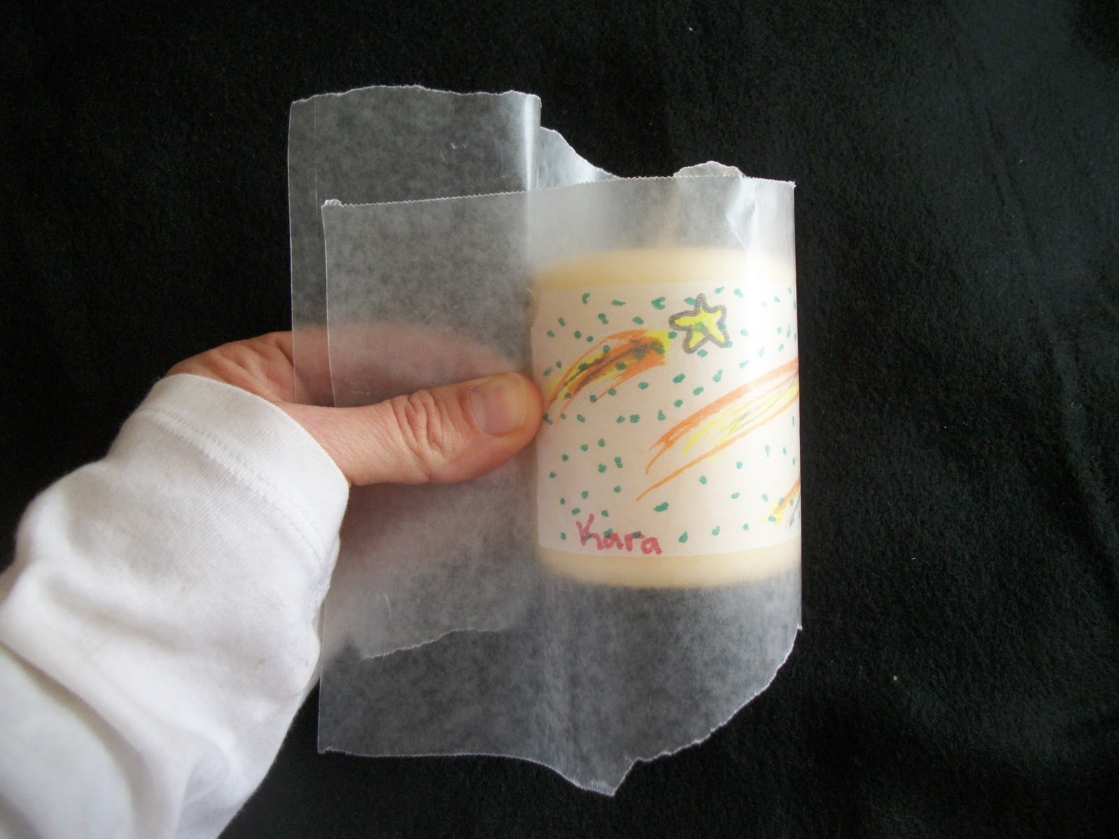 How to write on a candle with wax paper image