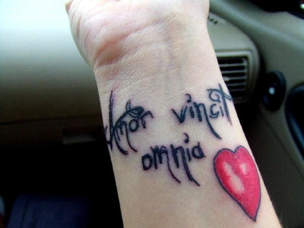 amor vincit omnia tattoo wrist. Tribal wrist tattoo designs?