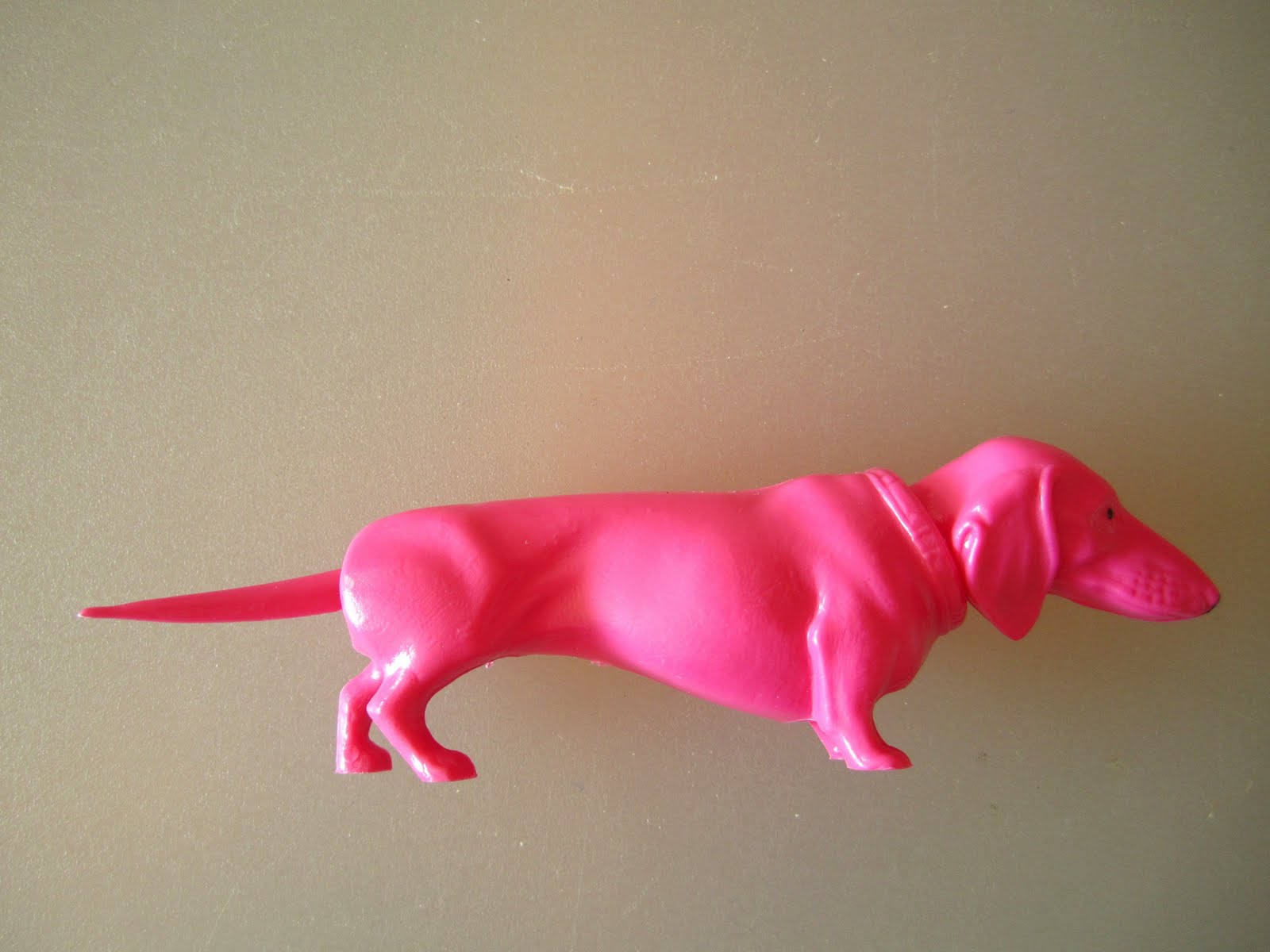 pink nodding dog