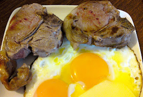 Lamb chops and fried eggs with butter
