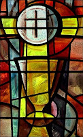 stained glass style picture of the communion cup and bread
