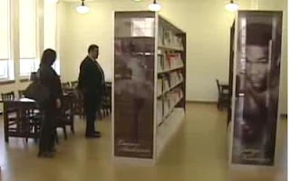 man and woman looking at books in Houston's Gregory Library
