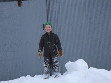 Grant playing in a big snow drift.