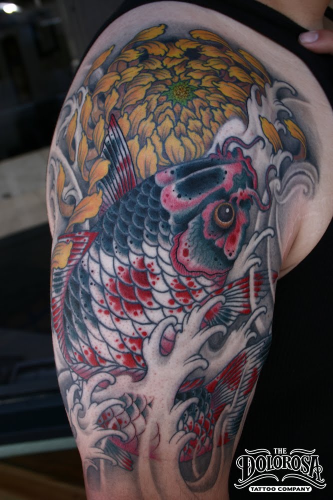 This carp and chrysanthemum tattoo took 4 sessions of about 45 hours over 