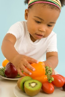 NAMC Montessori school nutrition and health tips child with vegetables