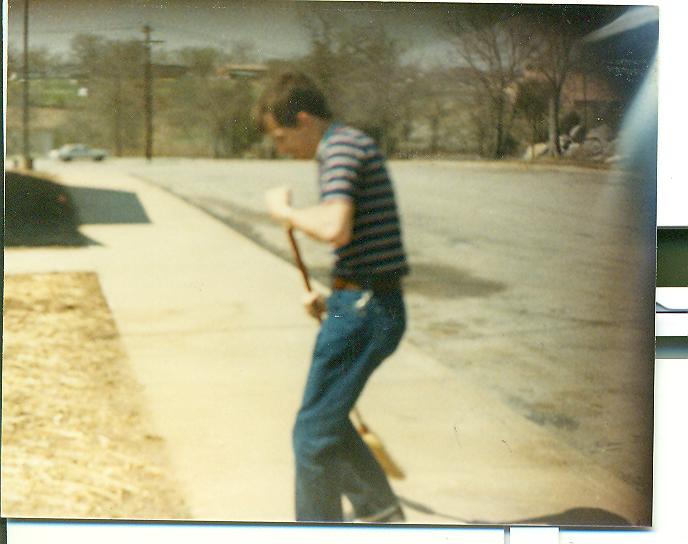 Ronnie Sanders sweeping outside chapel