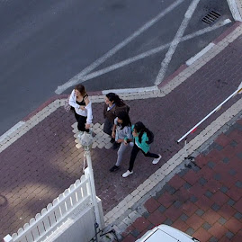 Teens Below the Balcony