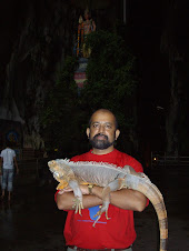 Author with a pet iguana at Batu Caves(Kuala Lumpur)
