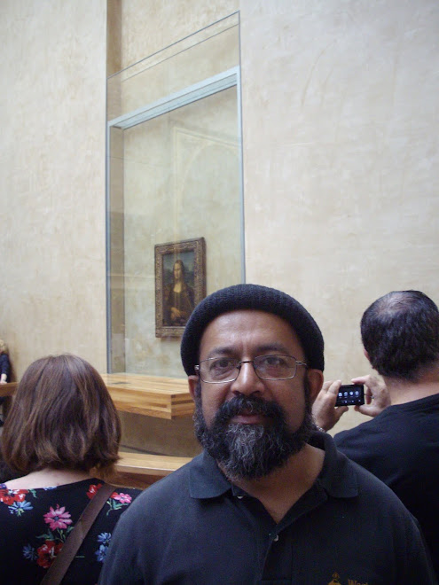 At "Louvre" with "Mona Lisa" in background.