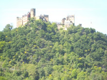 Castles on hillocks on banks of the Rhine river in Germany.