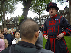 The famous "Yeoman Warder(Beefeater) guard  conducting a "Guided Tour" of the "Tower of London"