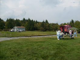 Bathroom facilities at the left, caboose on the right.