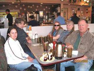 photo of Dan, Courtney, Wendy, Ginny, and Doug with Sophie under the table at Finnegan's