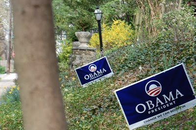 Obama signs in front yards.