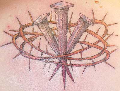 Intricately decorated Christian cross tattoo. nail cross tattoo