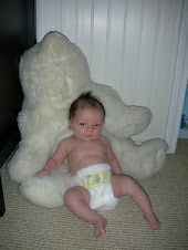 One month old in front of the bear