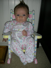 Elle in a baby doll chair