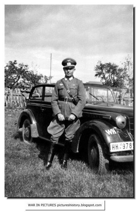 A German officer and the car Opel Olympia