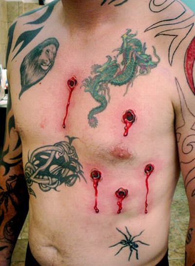 disturbed tattoo. skull tattoos with guns