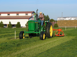 SPREADING WET HAY TO DRY