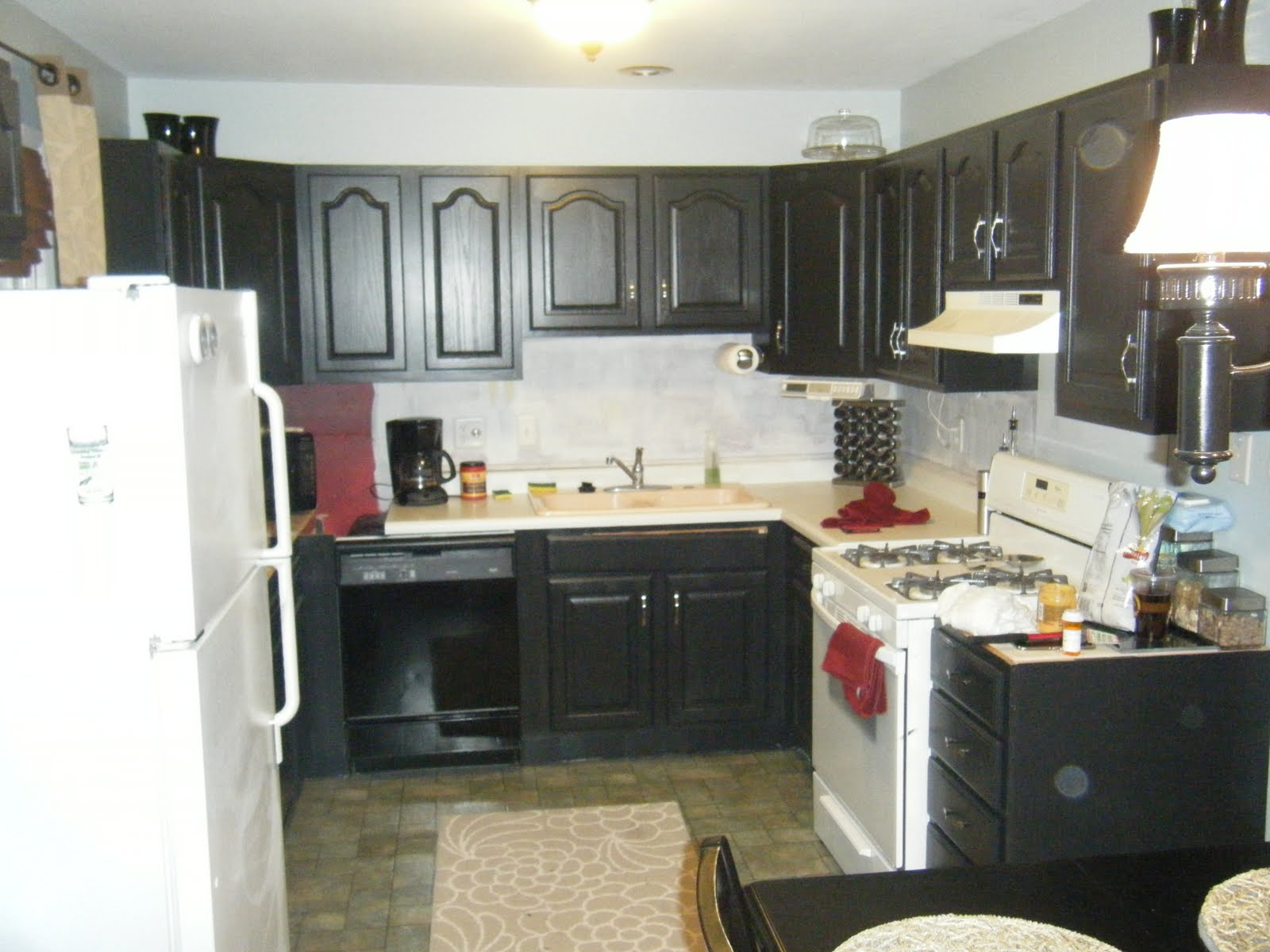 Before and after painted kitchen cabinets This is a picture of all the new added cabinets! It has given us