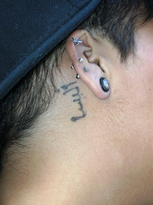 Alyssa offered up this Arabic tattoo, behind her right ear: