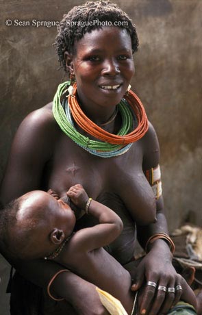 African+women+breastfeeding+animals