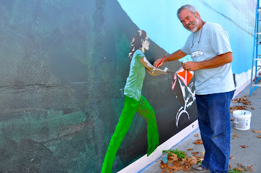 Figures being added to mural