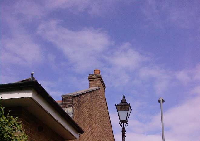 TWO LAMPOSTS, A CHIMNEY AND A ROOF ON BOOT HILL