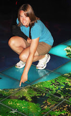 Erin pointing out "The Mount" on a huge map at Te Papa in Wellington