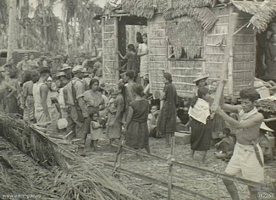 Philippines People Filipino Pinoy Pilipinas Old Black White Pictures evacuation leyte world war II WWII house nipa hut street scene noon