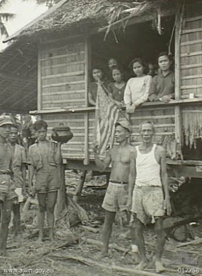 Philippines People Filipino Pinoy Pilipinas Old Black White Pictures evacuation leyte world war II WWII nipa hut street scene noon