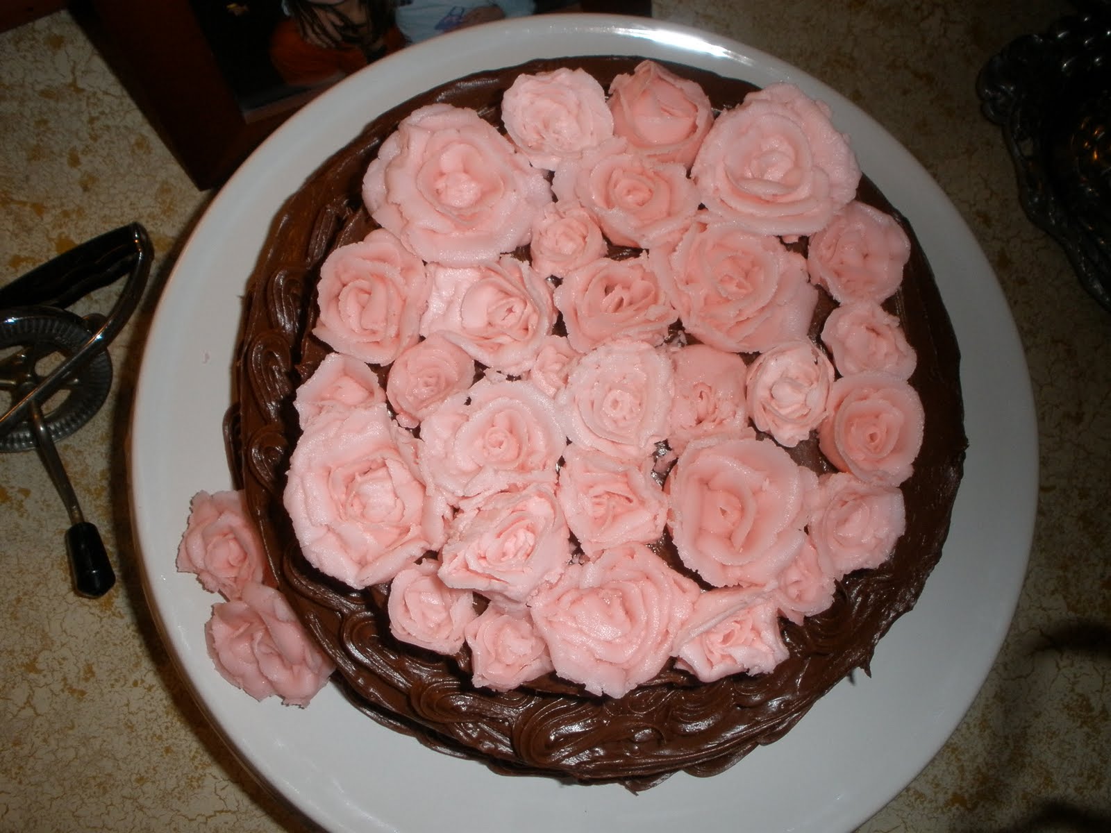 have your cake... and eat it too chocolate cake with pink roses on top