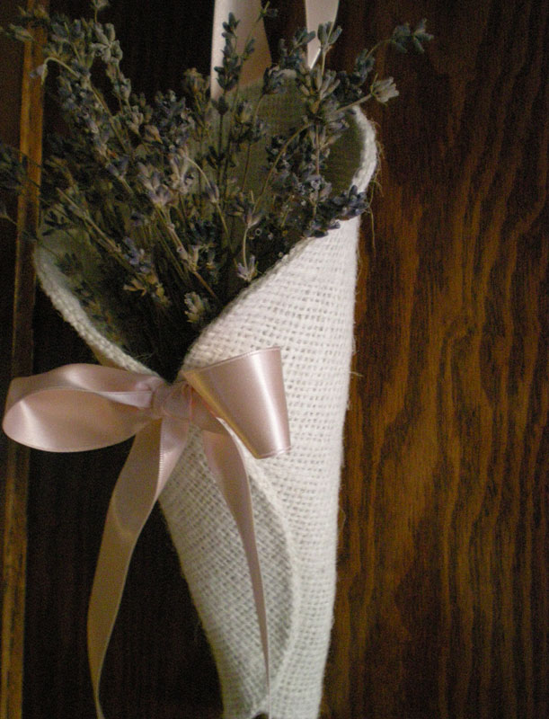 Spring weddings Here is a photo of an ivory burlap cone with a pale pink 