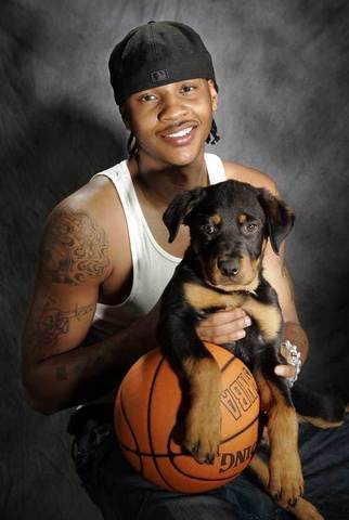 CARMELO ANTHONY AND HIS DOG
