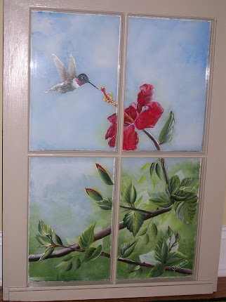 Hummingbird and Hibiscus on window