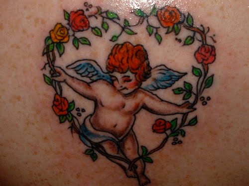 Cherub angel baby with red roses tattoo.