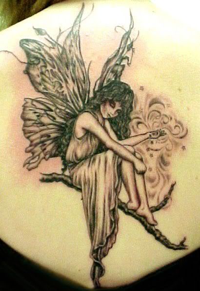 praying angel tattoo. angel on limb tattoo.