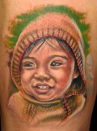 Cute kid with hood tattoo.