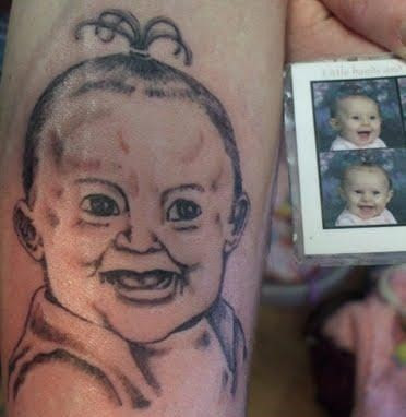 Ugly baby girl tattoo.