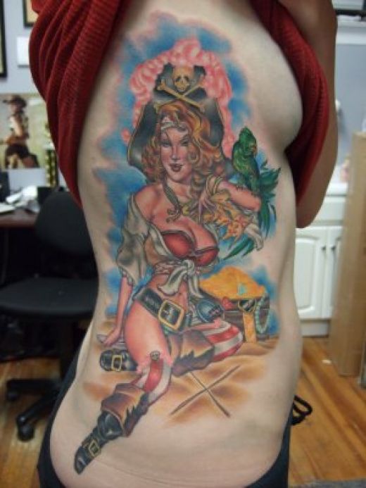 Pirate girl tattoo with parrot and treasure chest. Pirate girl tattoo with parrot and treasure chest.